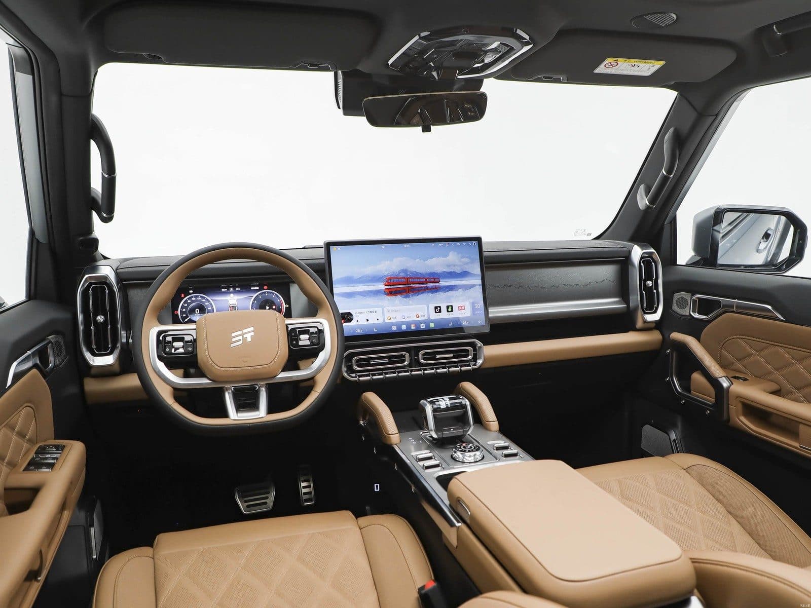 مقصورة Jetour T2 بمقاعد جلدية مبطّنة بلون بني فاتح وكونسول وسطي عريض